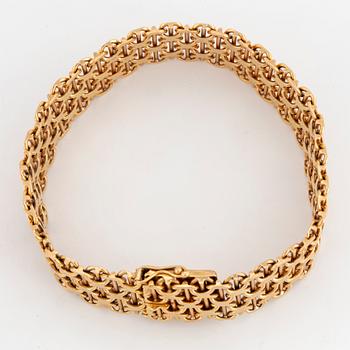 ARMBAND, krysslänk. 18K guld.