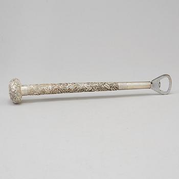 A silver handle for a cane, remodeled in to a can opener, China, 20th Century.