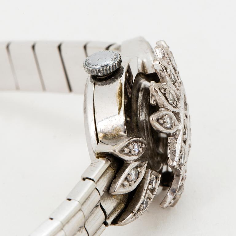 A ladies diamond watch.