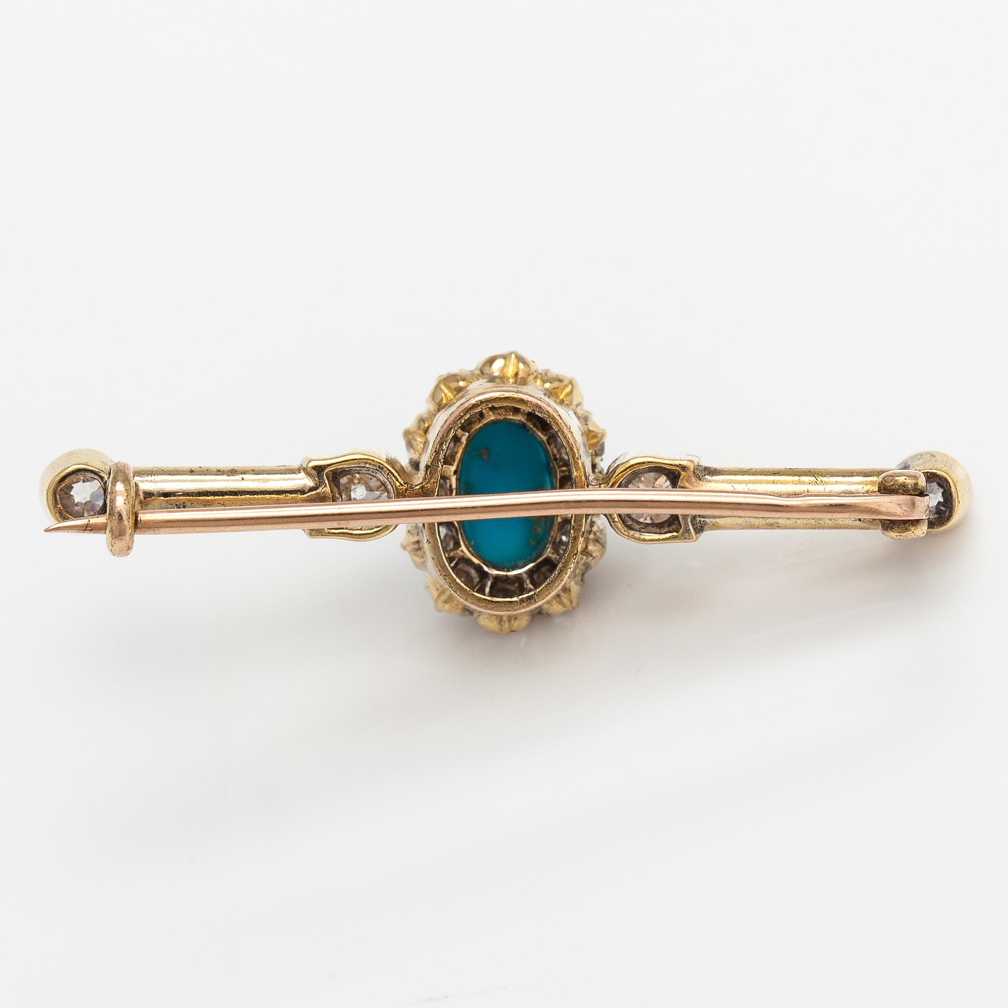 Brosch, 18K och 14K guld, turkos ca 0.95 ct och gammaslipade diamanter ca 0.95 ct tot.