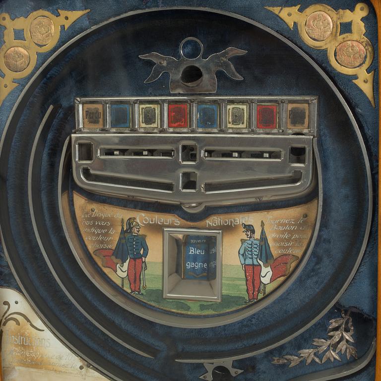A 'Coleurs Nationales' Bussouz slot machine, Paris, France, circa 1900.