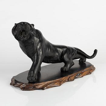 A Japanese bronze sculpture of a tiger, 20th Century.