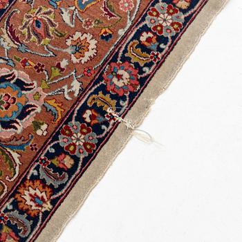 A semi-antique Tabriz carpet, 361 x 235 cm.