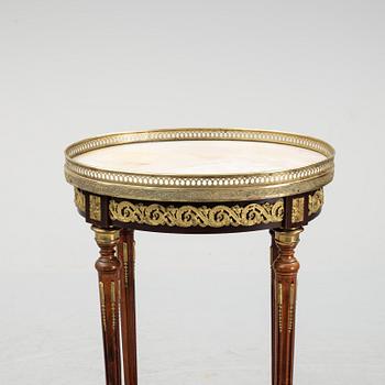 A French Louis XVI-style table, first half of the 20th century.