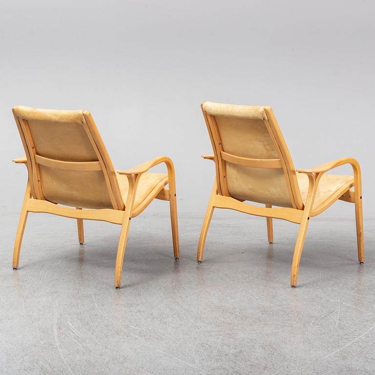 A pair of Laminett Yngve Ekström chairs.
