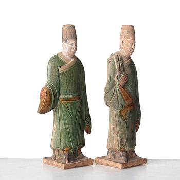Two green and yellow glazed pottery figures of Ming officials, Ming style, 20th Century.