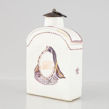 A porcelain tea caddie and mug with cover and saucer, China, Qing dynasty, late 18th century.