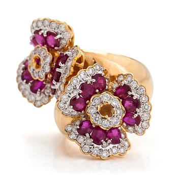 An 18K gold flower ring, with rubies and brilliant-cut diamonds totalling approximately 0.82 ct.