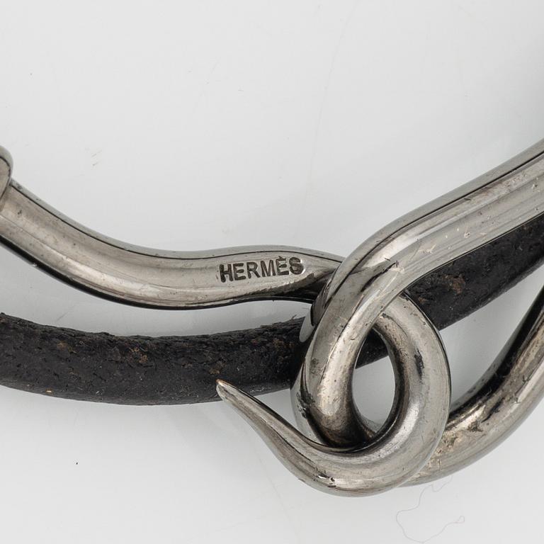 Hermès, a 'Jumbo' leather bracelet and a silk scarf.