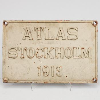 An iron sign,  "Atlas Stockholm 1913".