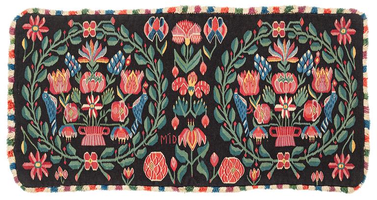 A carrige cushion 'Blomsterurna och fåglar i krans', tapestry weave, Scania, c 98 x 50 cm, around the year 1800.