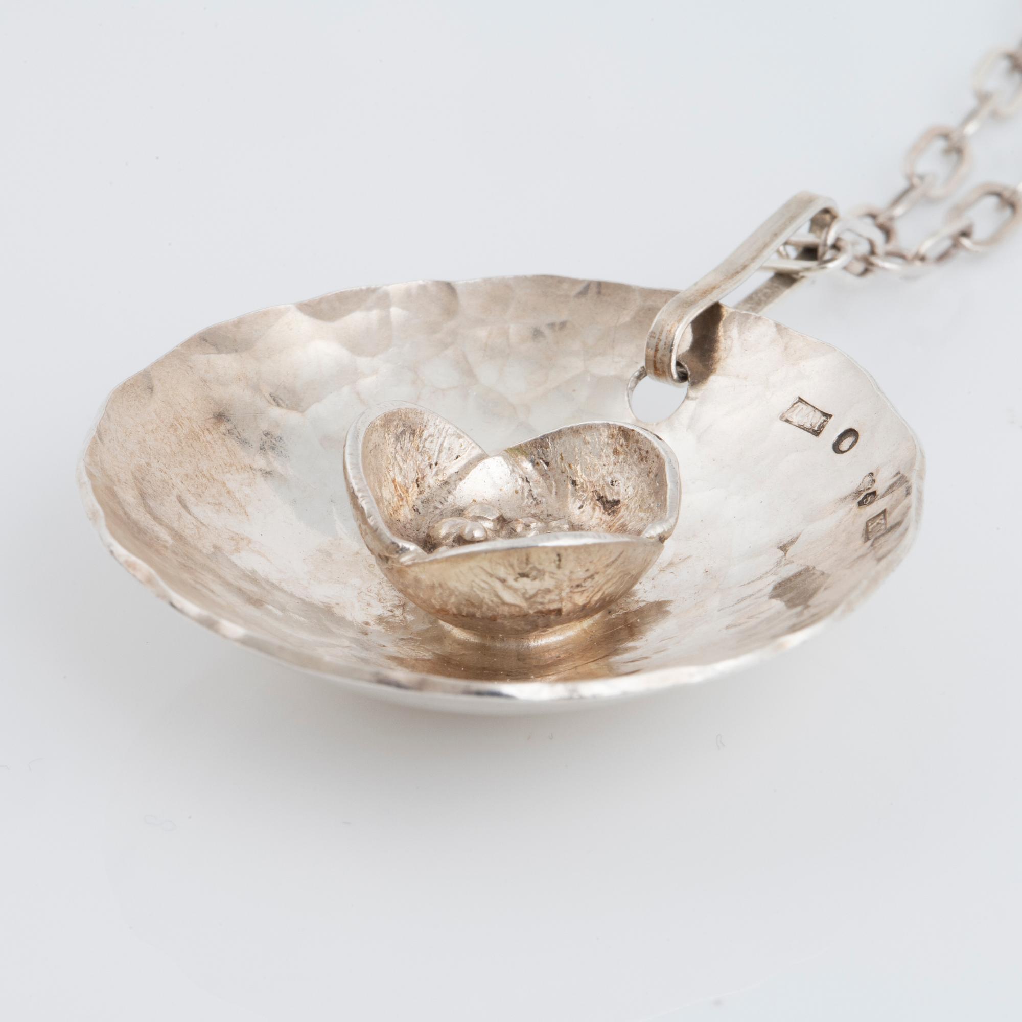 ROSA TAIKON a silver necklace.