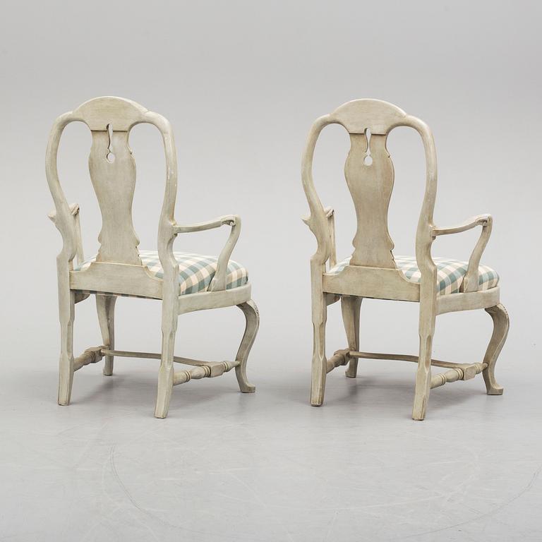 A pair of 20th century rococo style armchairs.