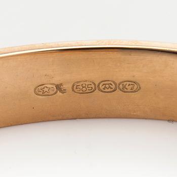 A 14K gold bracelet.