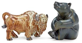 313. Two Gunnar Nylund stoneware figures, a bear and a bison, Rörstrand.