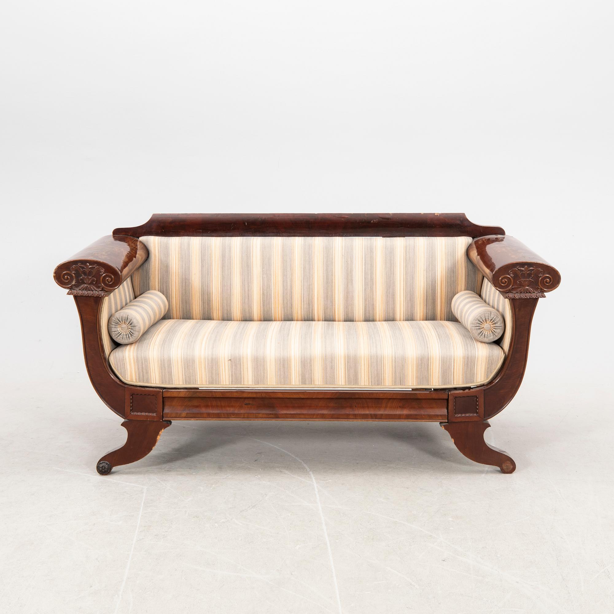 A mid 1800s late Empire mahogany sofa.