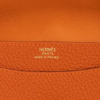 Hermès, a orange leather 'Dogon' wallet, 2003.