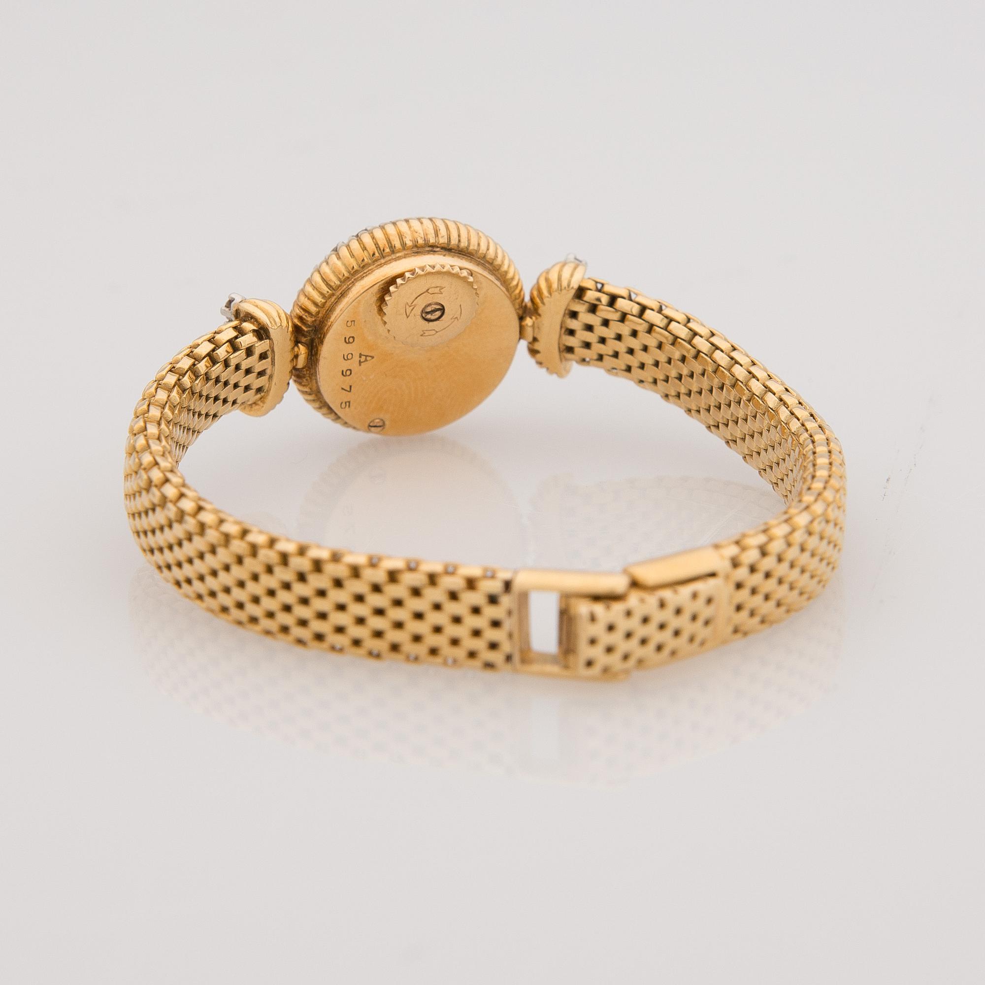 A WRISTWATCH, ladies Cartier, 18K gold, 28 pcs brilliant cut diamonds, totally c. 1,40 ct.