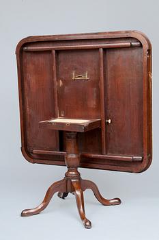 A DROP-LEAF TABLE.