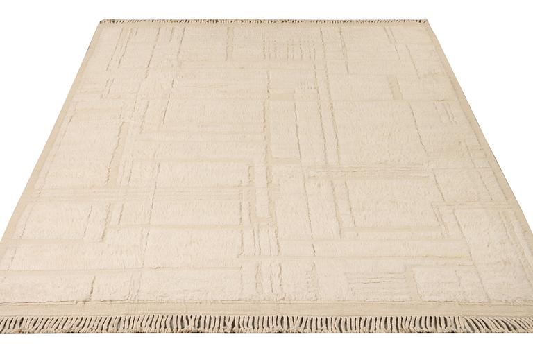 A relief-cut Moroccan carpet, c. 321 x 251 cm.