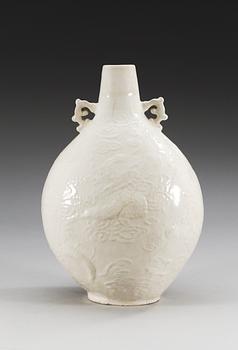A Ding type soft paste pilgrim bottle vase, Ming dynasty (1368-1644).