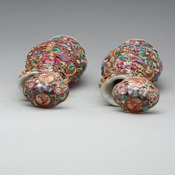 A pair of famille rose vases with covers, Qing dynasty, Qianlong (1736-95).