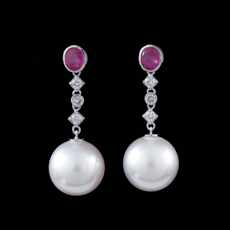 A pair of cultured pearl, 13 mm,  diamond and ruby earrings.