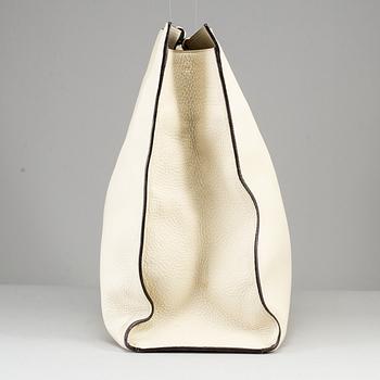 GUCCI, a white leather tote bag with bamboo handles.