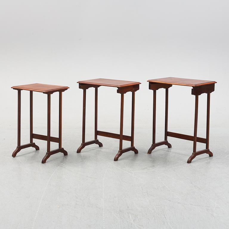 A three piece nesting table with inlay, first half of the 20th Century.