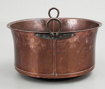 A late 19th century copper cauldron.