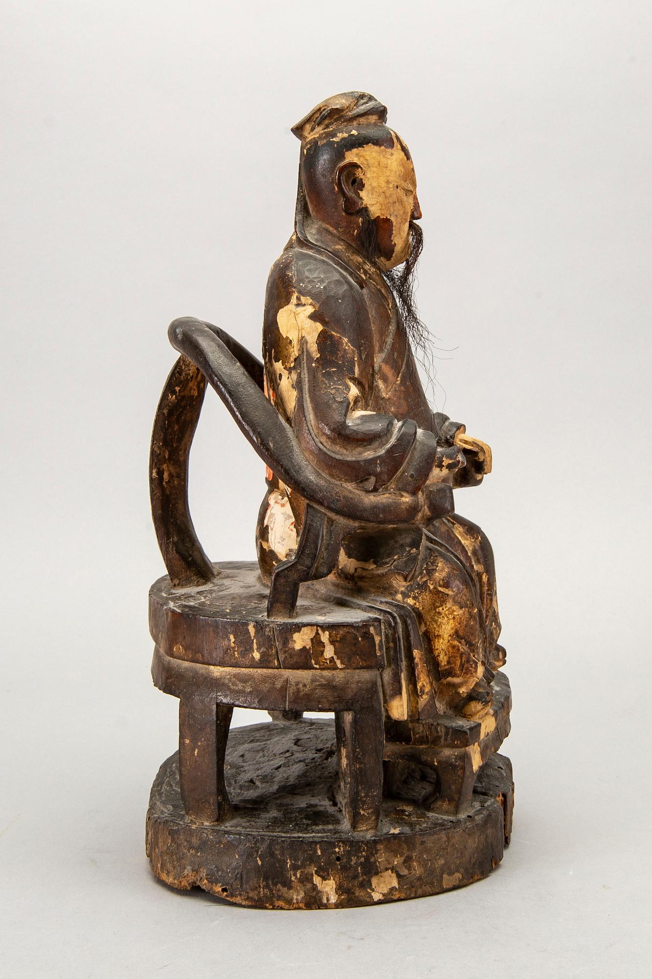 A Chinese late Qing painted wooden sculpture.