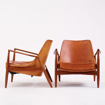 Ib Kofod-Larsen, a pair of teak and cognac coloured leather "Sälen" easy chairs, Olof Perssons Fåtöljindustri (OPE), Sweden, 1950-60's.