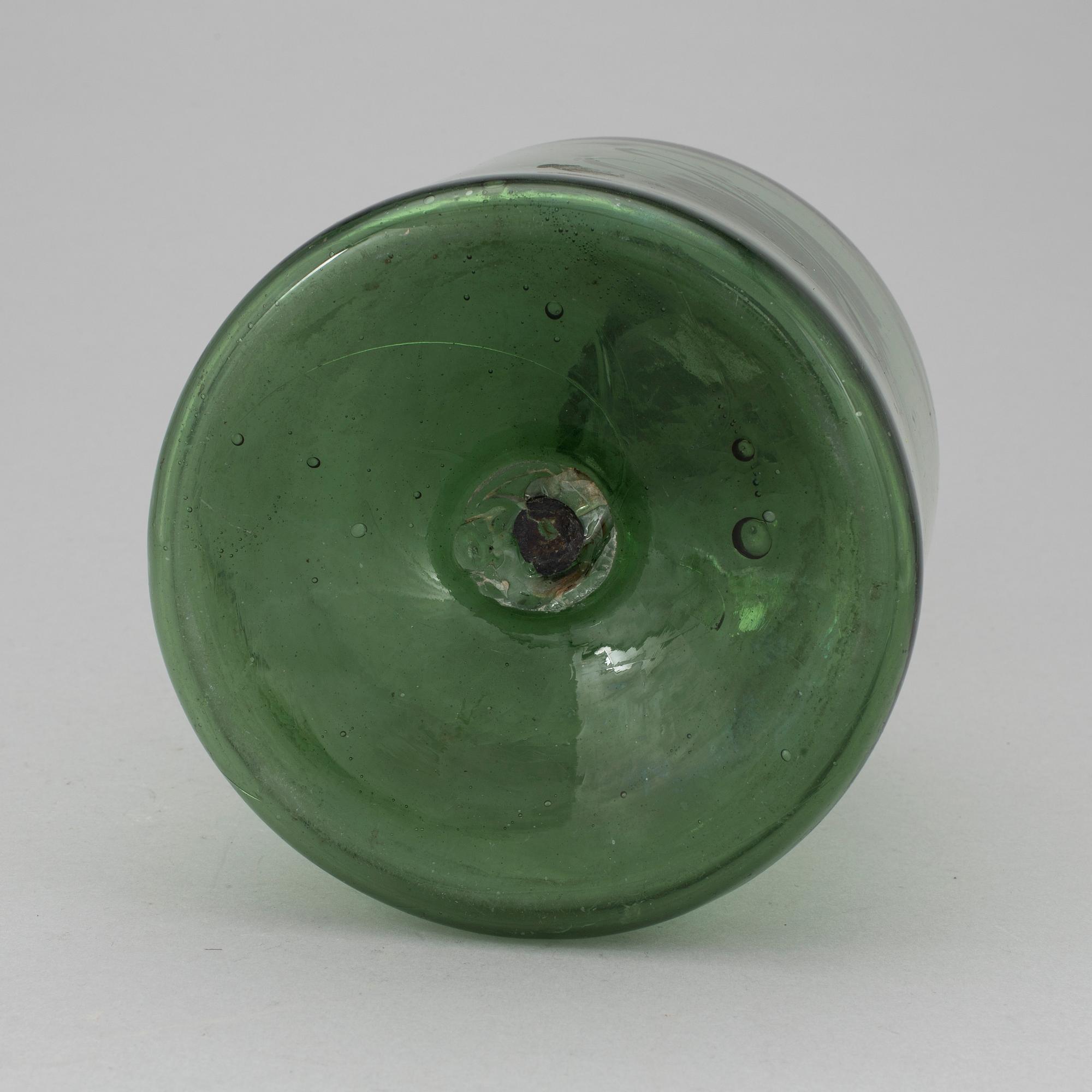A 18th or 19th century glass bottle.