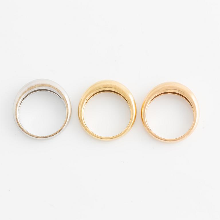 Tre ringar 18K guld i olika färger.