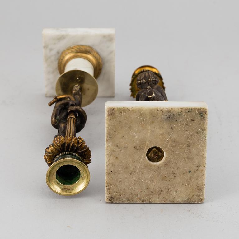 A pair of gustavian style candles sticks, circa 1900.