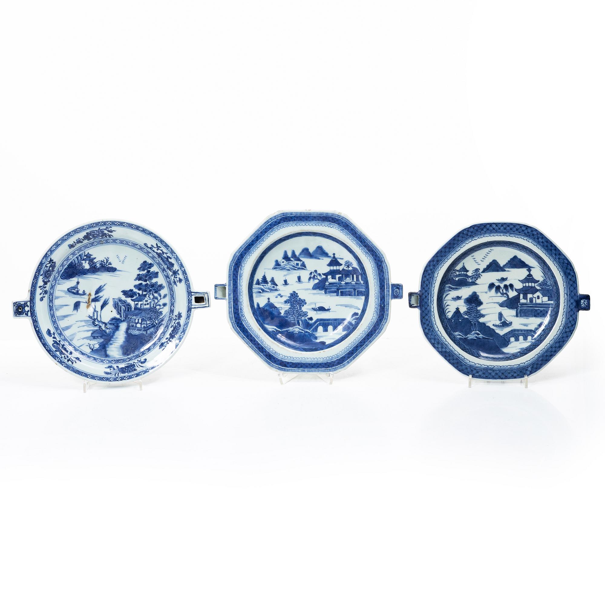 A group of three Chinese blue and white porcelain hot water dishes, Qing dynasty, 18/19th century.