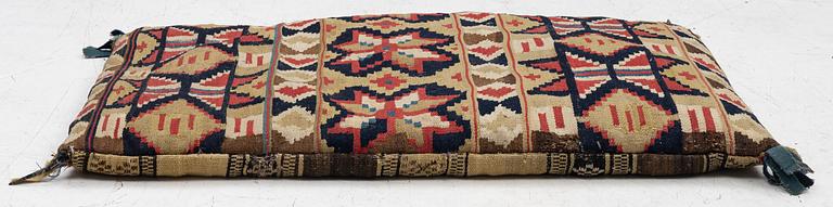 A mid-19th century carrige cushion, flat weave, c. 80 x 46 cm southwest Scania.