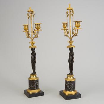 A pair of 1800s empire candelabras.