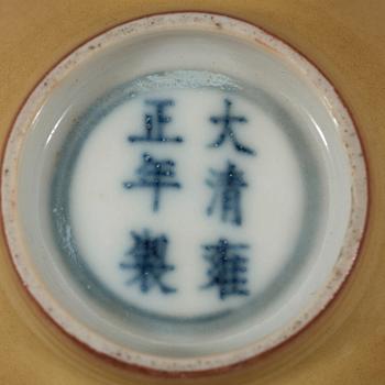 A pair of Imperial yellow bowls, Qing dynasty, Yongzheng six-character mark and of the period (1723-1735).