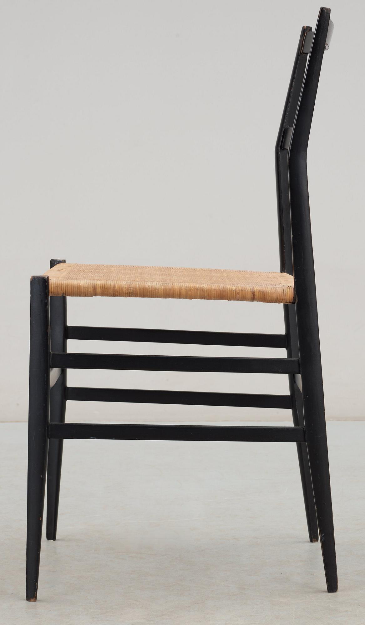 A Gio Ponti 'Superleggera' chair, Cassina, Italy, black painted ash with ratten seat.