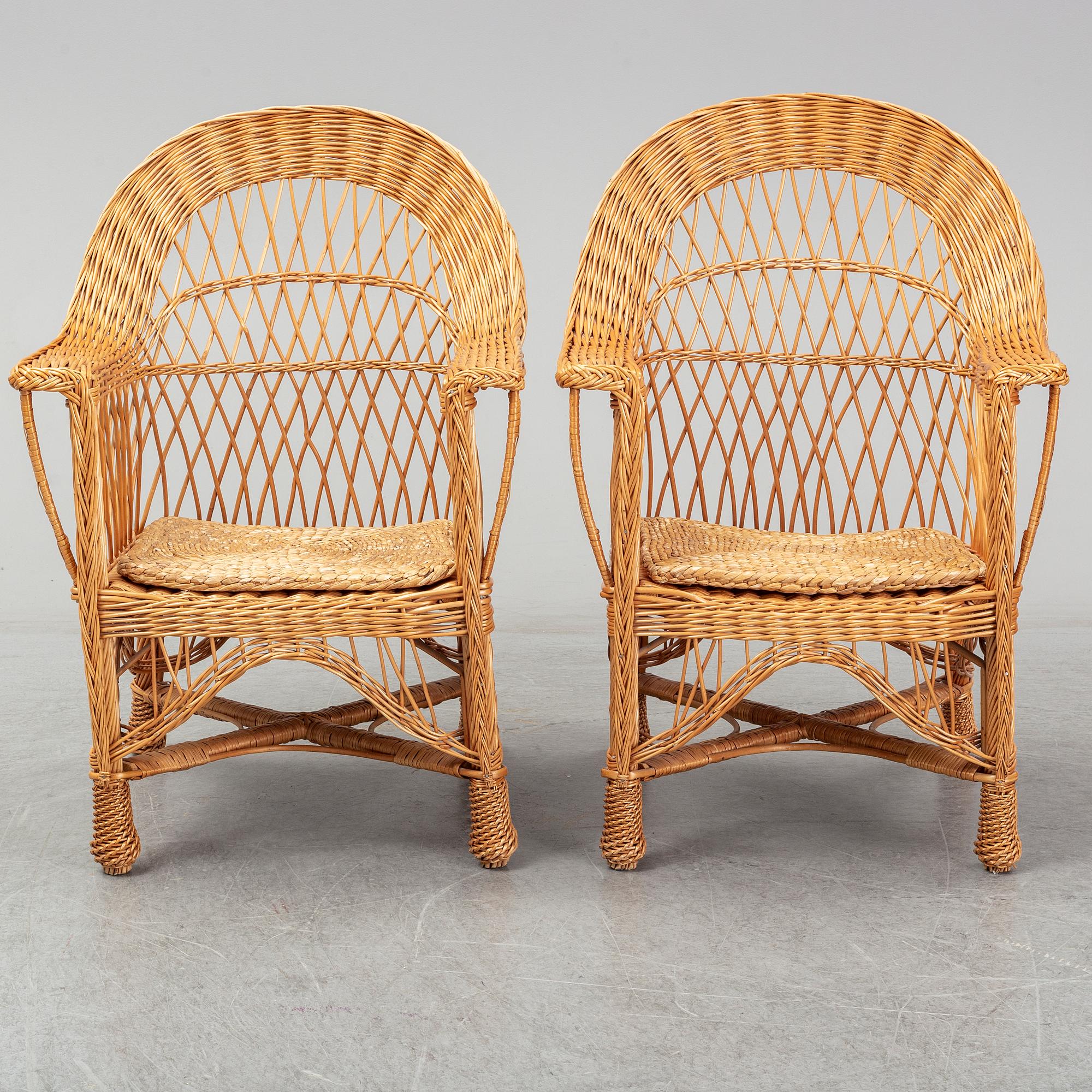 A pair of 1970s/1980s rattan armchairs.