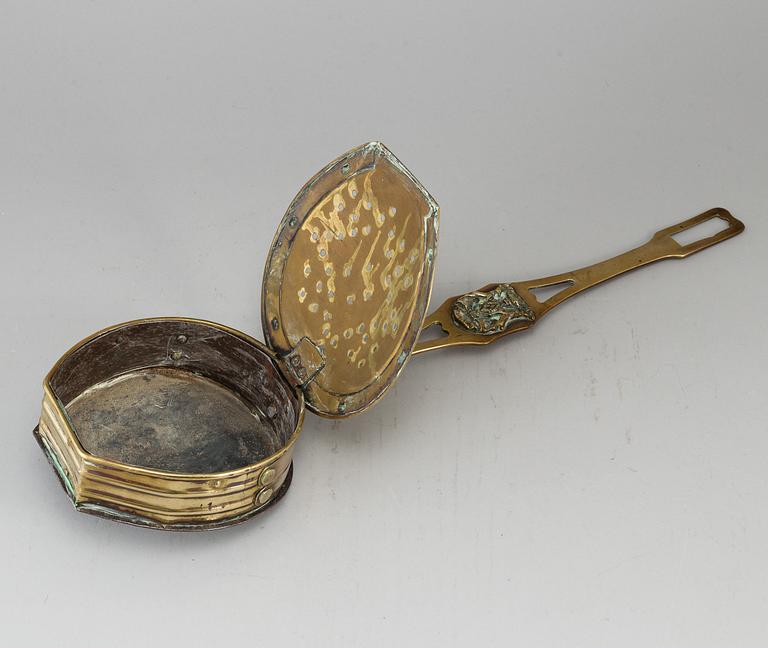 A brass chestnut roaster, 19th century.