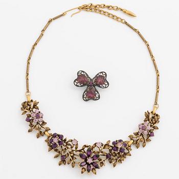 Necklace and brooch with purple stones.