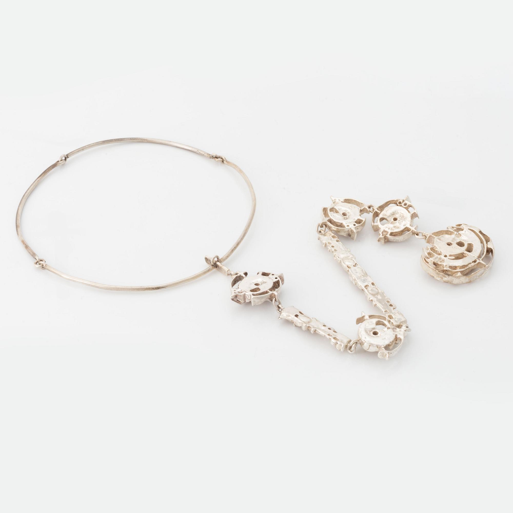 Juhls silver necklace.