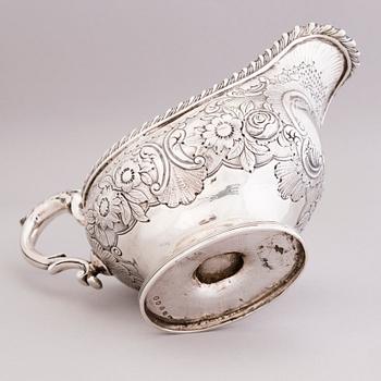 An English early 19th century silver cream-jug, mark of Abraham Peterson, London 1803.