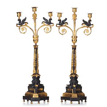 A pair of three-light Empire candelabra, early 19th century .