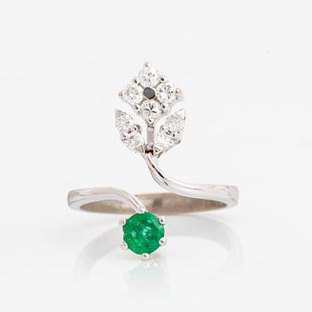 Emerald and brilliant cut diamond ring.