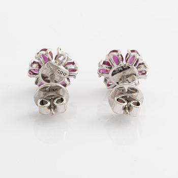 Earrings, one pair, white gold with rubies and small diamonds.