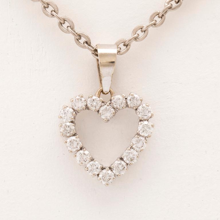 An 18K white gold pendant set with round brilliant cut diamonds.