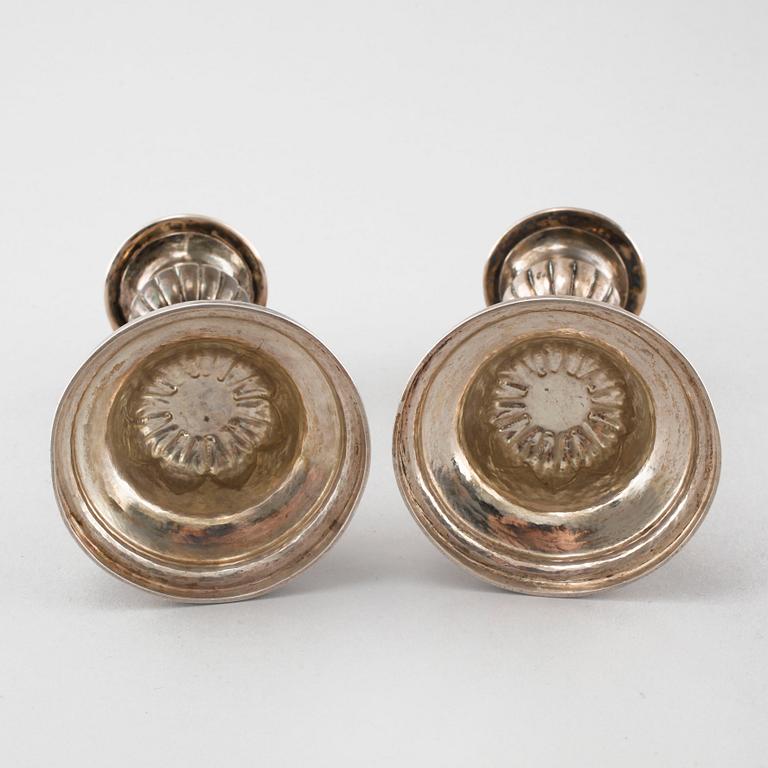 A pair of silver candelsticks by Daniel Eklund, Kalmar, empire, 1854, weight 163.